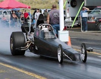Lexihaunted in her sleek black dragster smoking her tires as she queues up to the starting line.